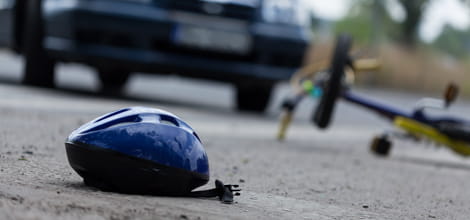Cycle helmet next to car